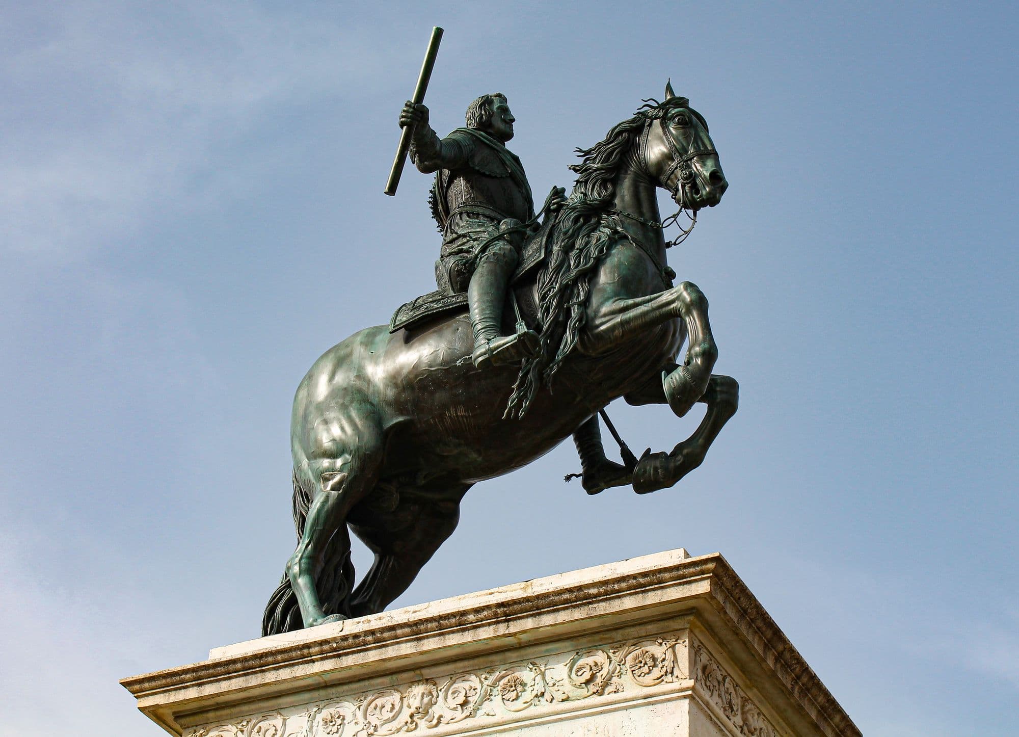 Statue of a Spanish monarch in the gardens of Plaza de Oriente, outside the Royal Palace